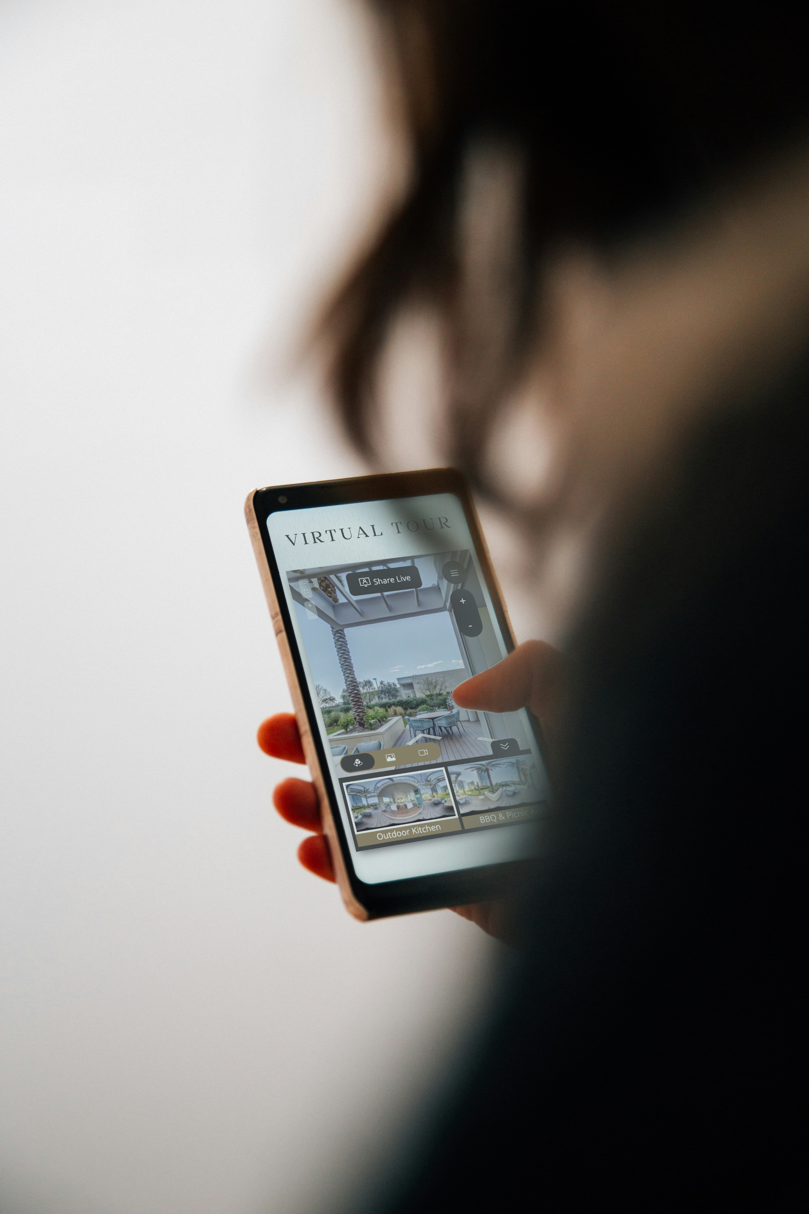 A person holding a phone, ready to access turnkey solutions at their fingertips.